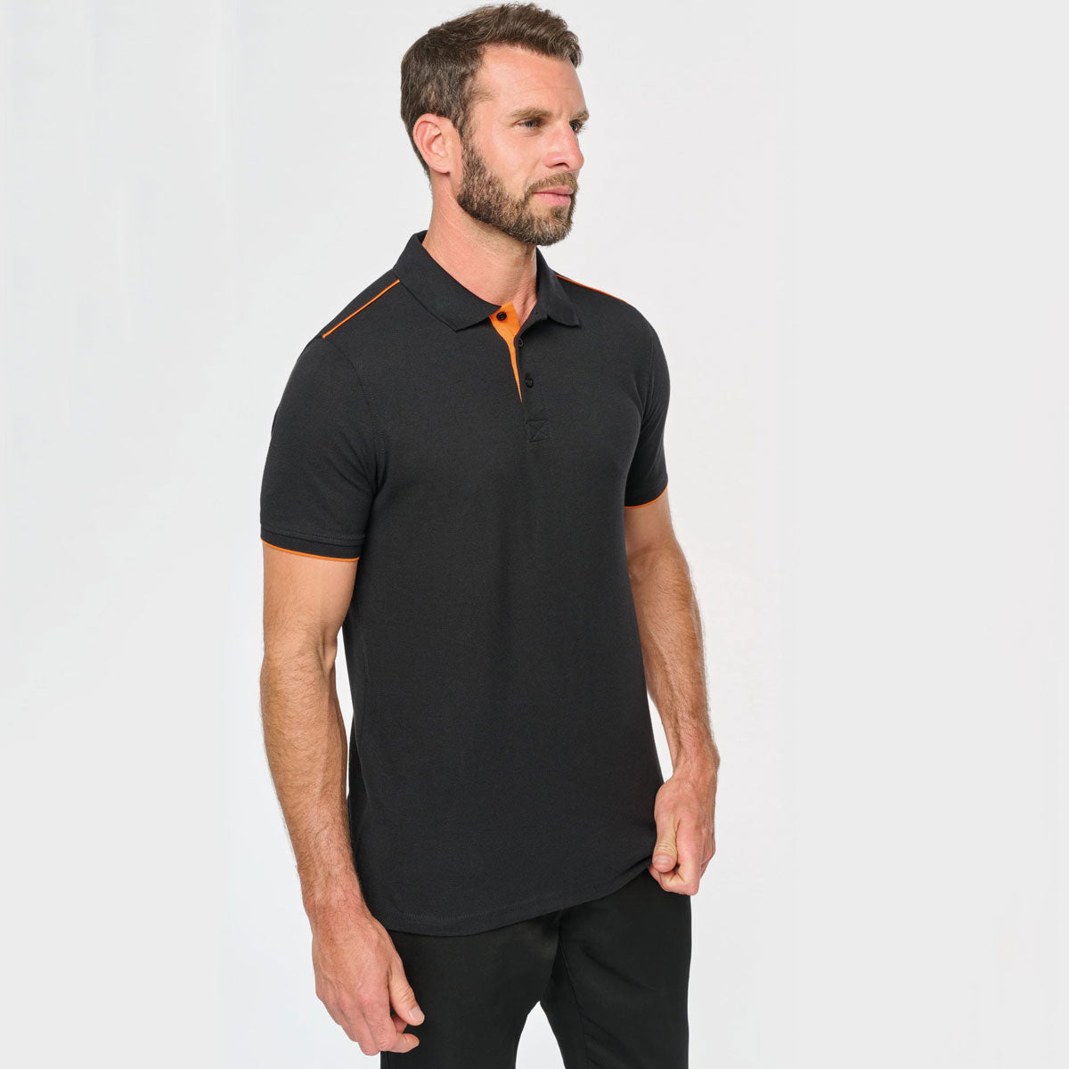 Polo homme noir avec détails orange à personnaliser en broderie - modèle WK270