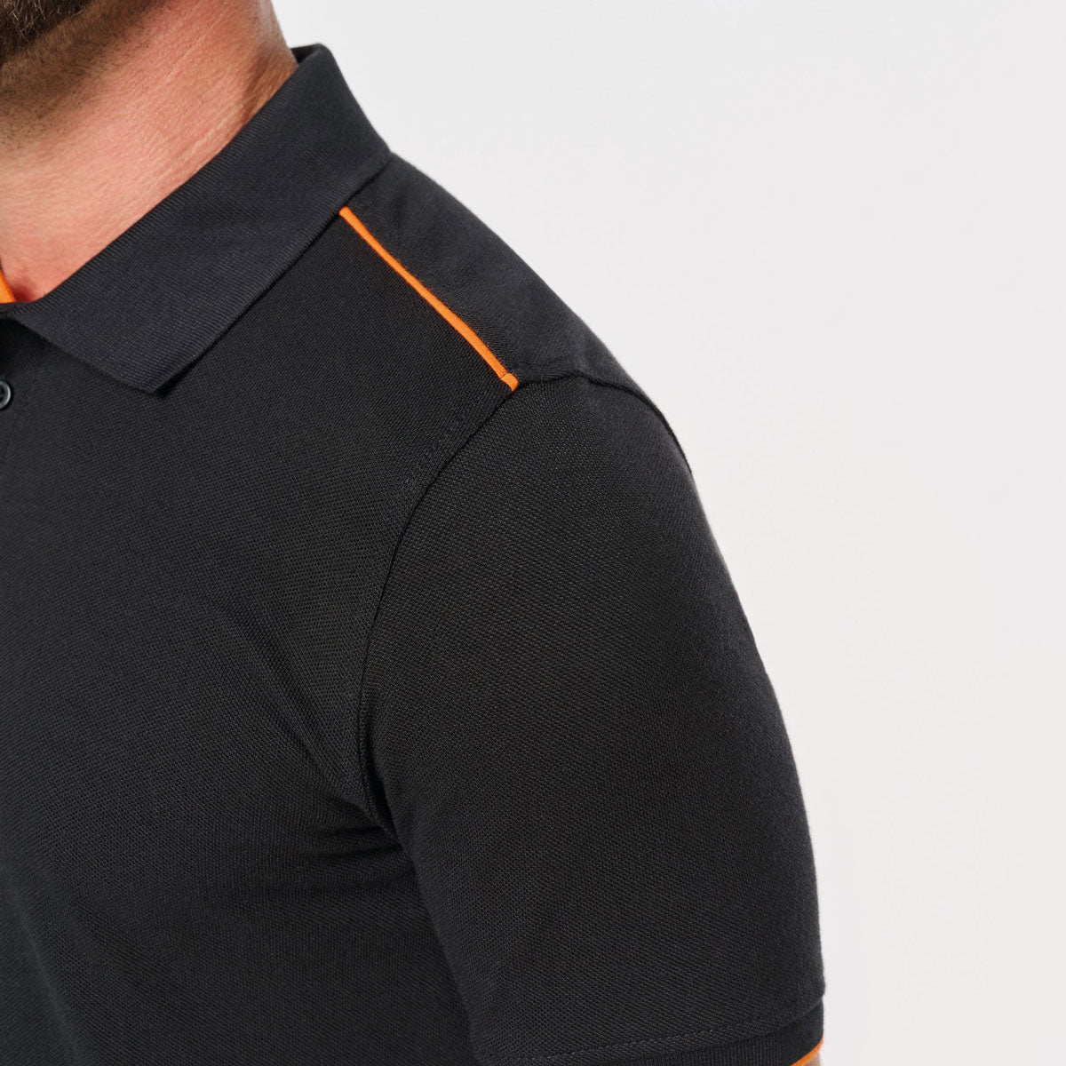 Polo manches courtes contrasté noir orange à broder pour entreprise